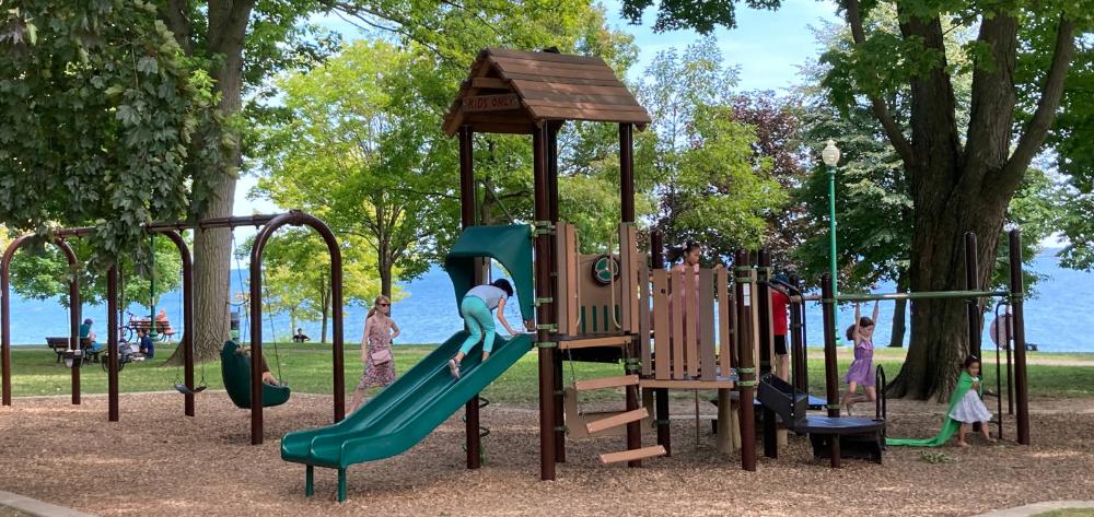 Children playing on a public park. Photo by Oakville News on Unsplash.