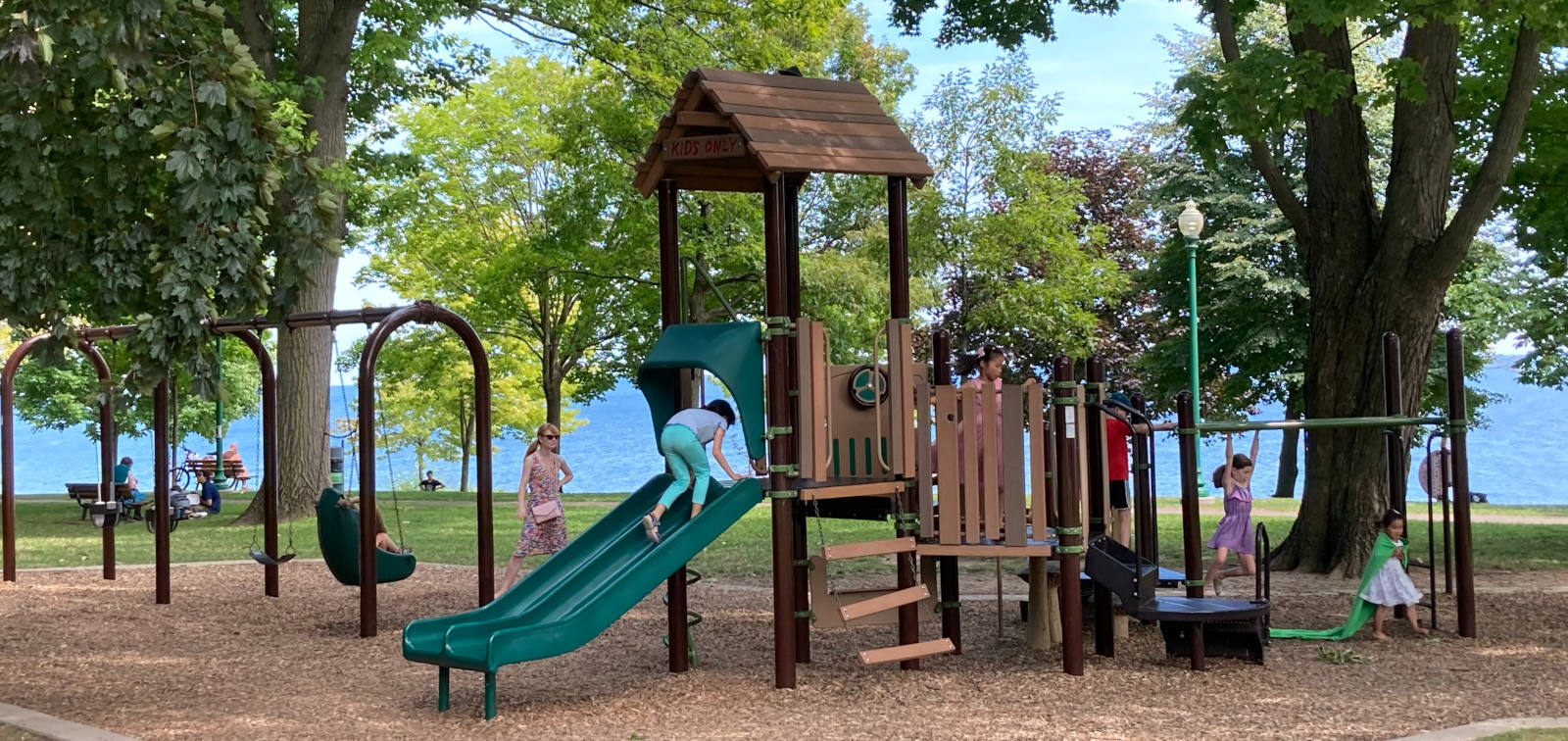 Children playing on a public park. Photo by Oakville News on Unsplash.