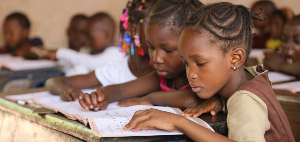 Two girls are learning to read in a school in Bamako, Mali | The photo is from USAID in Africa