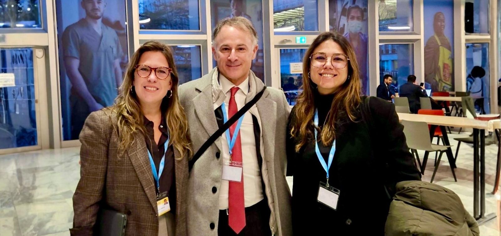 Photo with three researchers at the WHO headquarters.