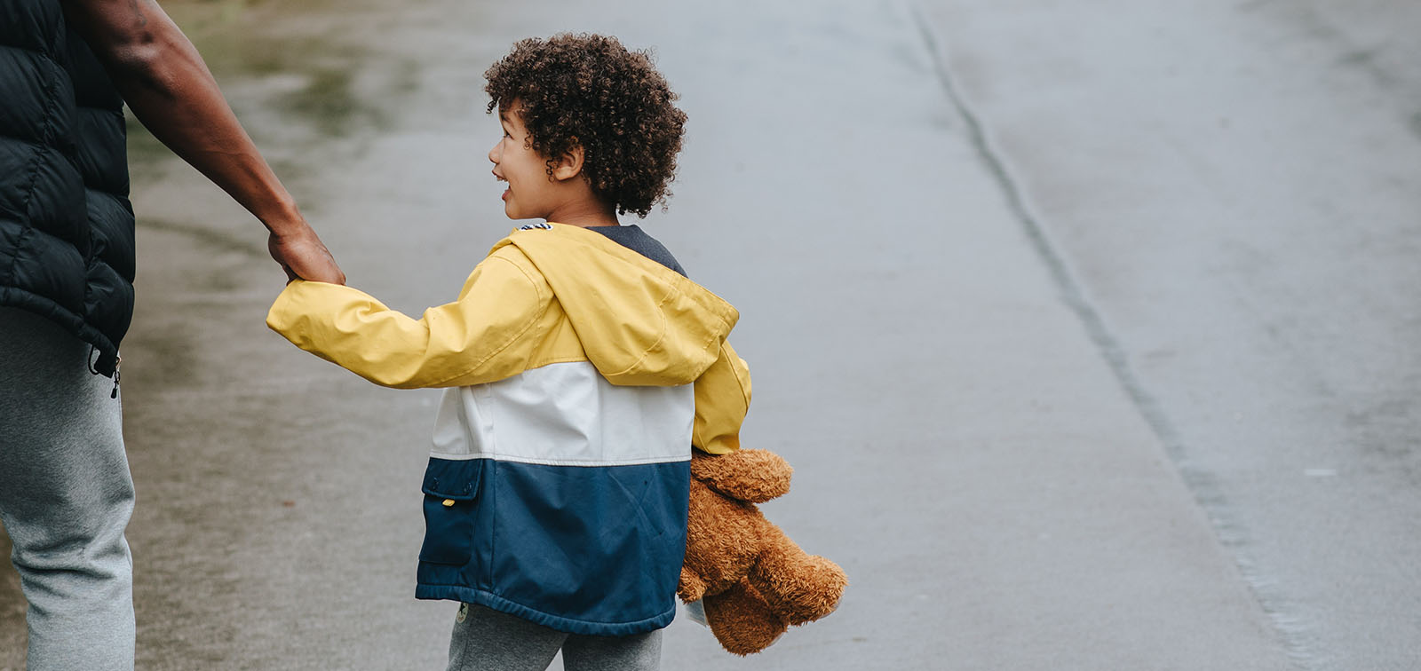 A child walking beside his father